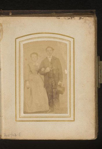 Portrait of a man with a hat in his hand and a woman