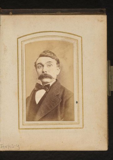 Portrait of a man with a moustache and a bow tie