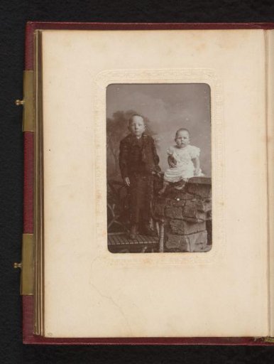 Portrait of a Standing Boy on a Bench and a Seated Baby
