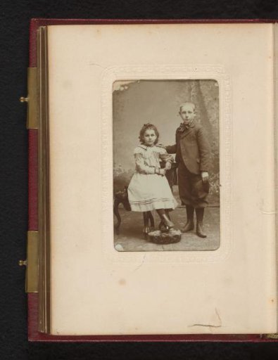 Portrait of a seated girl and a standing boy