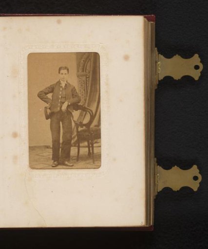 Portrait of a Young Man with a Cap in His Hand, Standing by a Chair