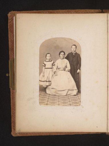 Portrait of a seated woman and a standing boy and a standing girl