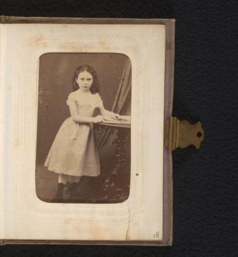 Portrait of a girl at a table