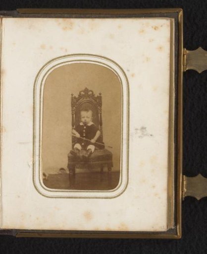 Portrait of a child seated on a chair