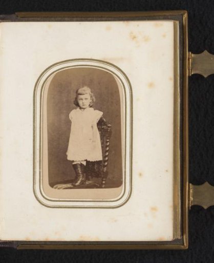 Portrait of a girl standing on a chair