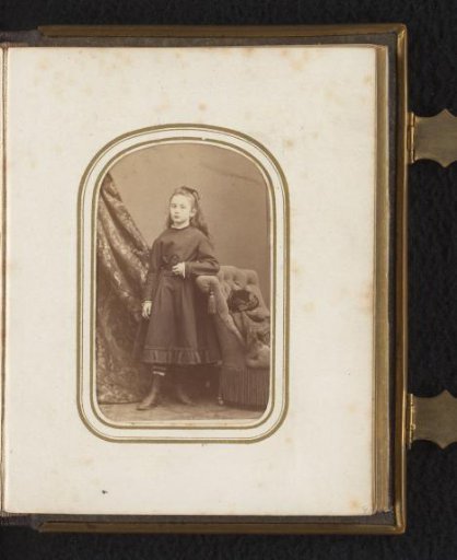 Portrait of a girl leaning on a chair