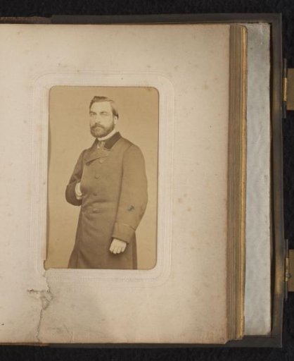 Portrait of a man with a hand in his jacket