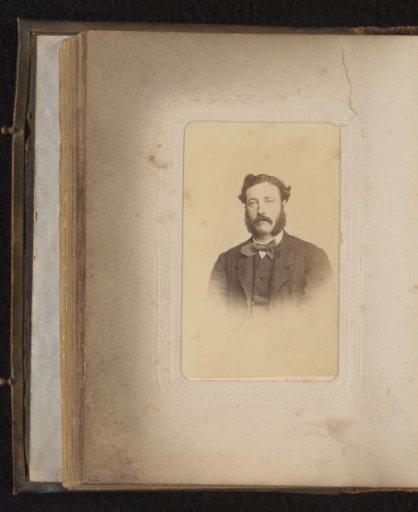 Portrait of a man with a moustache and sideburns