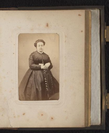 Portrait of a standing woman by a chair, designated as G. Lerat