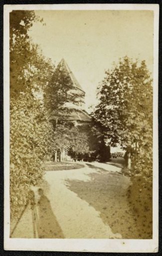 View of the Valkhof Chapel (St. Nicholas Chapel) in Nijmegen with the shadow of the photographer in the foreground left