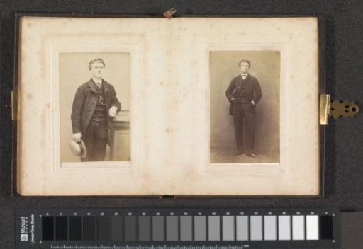 Portrait of a man, possibly a student, standing with both hands in pockets