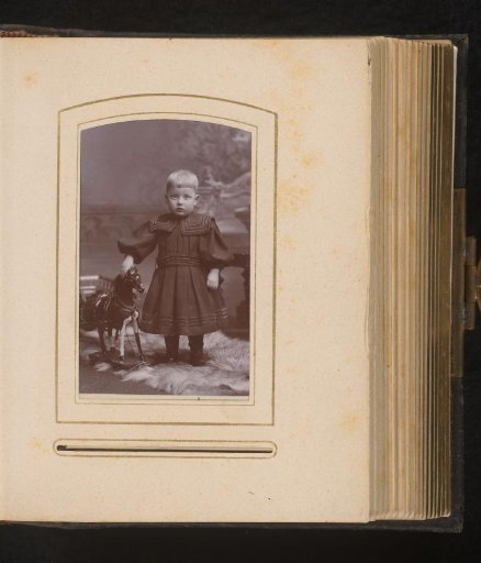 Portrait of a Child with a Rocking Horse