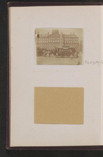 Horse-drawn tram in front of the Royal Palace on the Dam