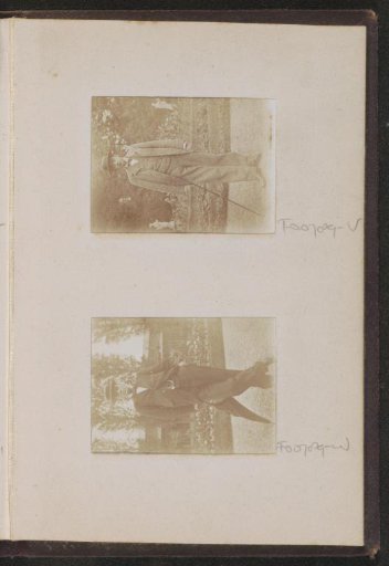 Portrait of a standing man with a walking stick and hat in a park