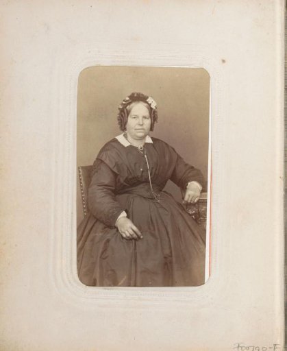 Portrait of a seated woman with ringlets and a cap