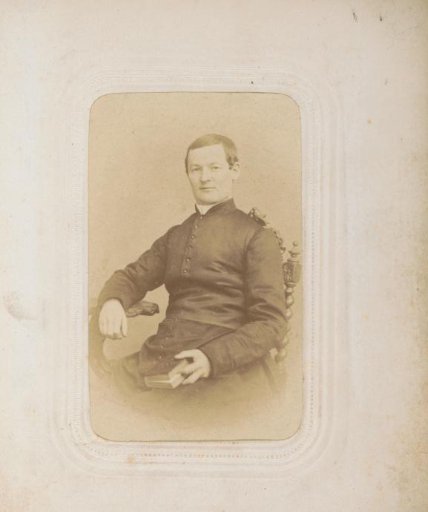 Portrait of a seated cleric holding a book