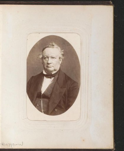 Portrait of a man in a coat with a cord around his neck
