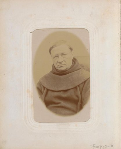 Portrait of a cleric with glasses in a robe