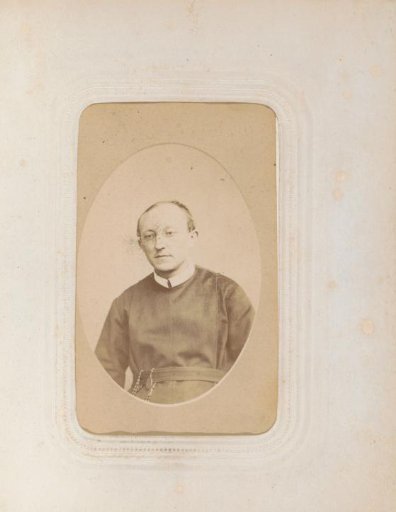 Portrait of a cleric with glasses and a rosary at his belt