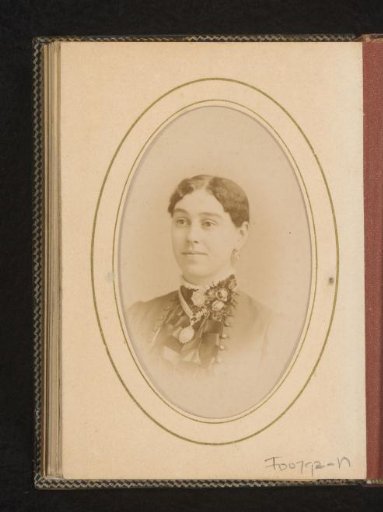 Portrait of a woman with a necklace, earrings and brooches