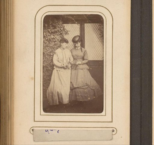 Two women by an ivy