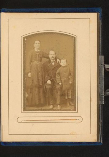 Portrait of a standing woman, a sitting man and a standing boy