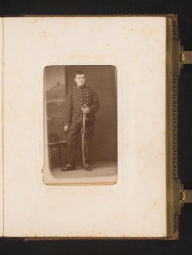 Portrait of a Standing Boy in Military Uniform Holding a Sword