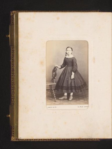 Portrait of a Girl Standing by a Chair