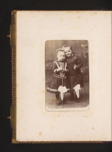 Portrait of Two Girls with Umbrellas