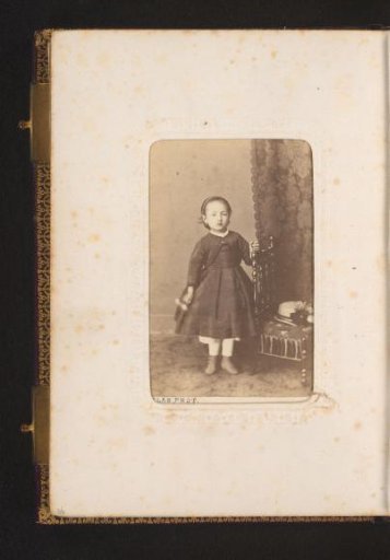 Portrait of a Girl Standing by a Chair with a Hat