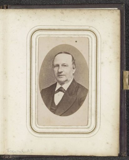 Portrait of a man with sideburns in a coat