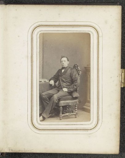 Portrait of a seated man in a coat