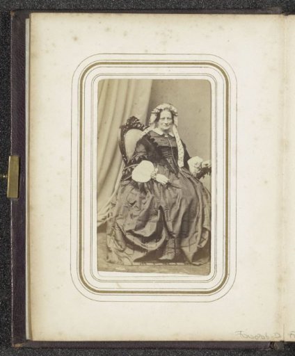 Portrait of a seated woman in a dress with a cap with ribbons