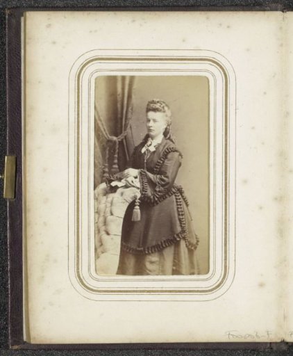 Portrait of a standing woman in a dress