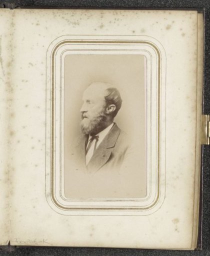 Portrait of a balding man with a beard