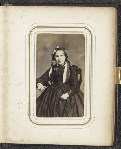 Portrait of a seated woman with a cap with ribbons