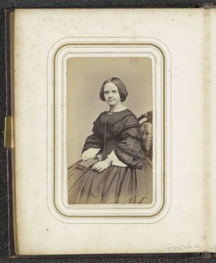 Portrait of a seated young woman with a book on her lap