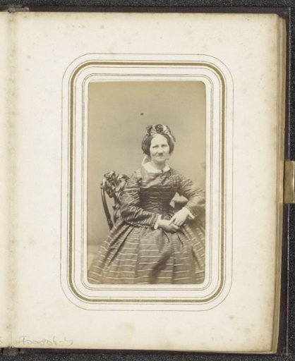 Portrait of a seated woman in a striped dress with a floral cap