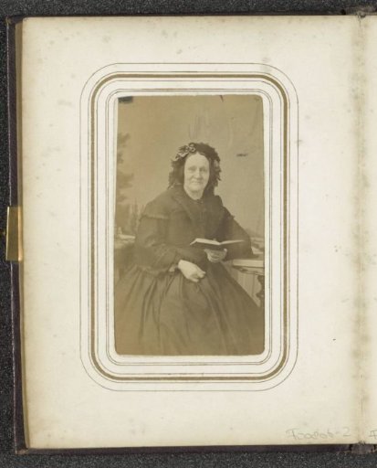 Portrait of a seated woman with a cap and an open book in her hand