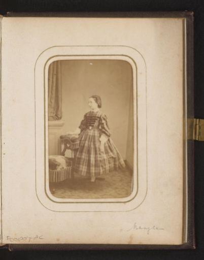 Portrait of a girl, standing by a chair