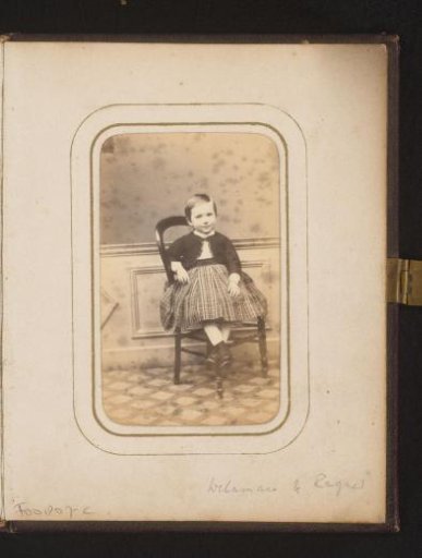 Portrait of a girl, seated on a chair