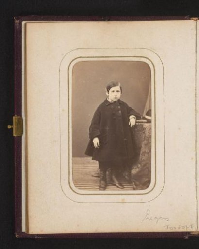 Portrait of a standing child in a cloak, identified as Gustave Lerat fils