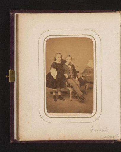 Portrait of a sitting boy and a standing girl