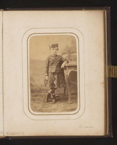 Portrait of a girl, standing by a table