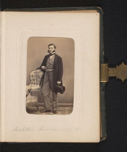 Portrait of a Man with a Top Hat in Hand, Standing by a Chair