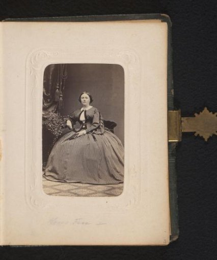 Portrait of a seated woman with a book in her hand
