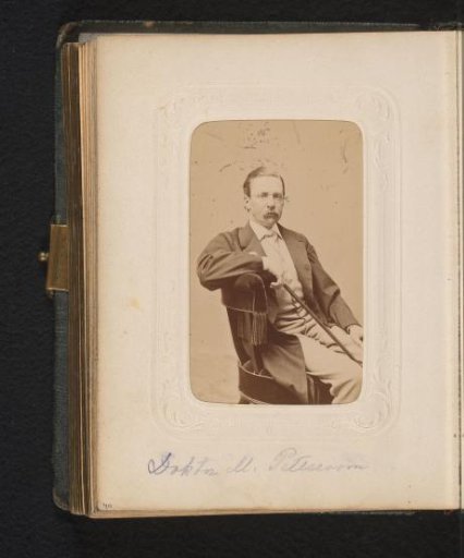 Portrait of a seated man with a walking stick in his hand