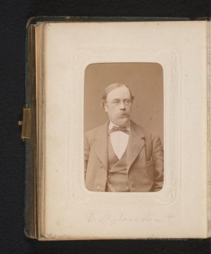 Portrait of a man with a moustache and spectacles, identified as O. Nylander