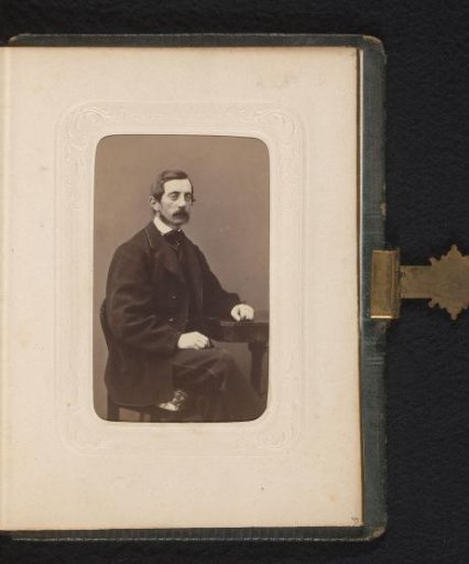 Portrait of a seated man with a moustache, identified as Axel Palen