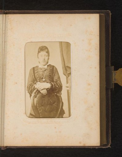Portrait of a Standing Woman by a Chair